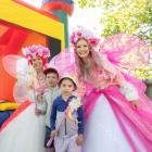 Fairies Blossom (Katie Lindsay, left) and Buttercup (Wanja Carree-Joll) entertain Erik, 7, and...