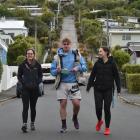 Walking Baldwin St for a good cause yesterday are (from left) Amber Wuill Proctor, of...