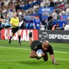 Mark Telea scores for the All Blacks in the World Cup opener against France. Photo: Getty