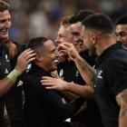 All Black halfback Aaron Smith (centre) celebrates with his team-mates after scoring a try in his...