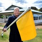 Belleknowes Golf Club vice-president Gordon Wilson holds a flagstick outside the new clubhouse....