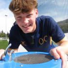 Cricket coach Tyler Harris, of Queenstown, tastes the water from a drinking fountain outside the...