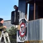Vaughn Moir (left), of Teviot and David Pattillo, of Wanaka, install new speakers on the...