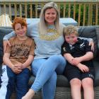 Helping support each other are the Roberts family (from left) Liam, 10, Jess and Isaac, 8. PHOTO:...