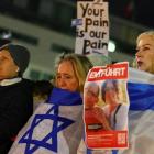 People commemorate the victims of October 7 Hamas' attack in front of Brandenburg gate, amid the...