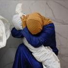 A Palestinian woman cradles the body of a child who died in an Israeli airstrike on Khan Younis...