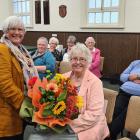 Oamaru Bridge Club member Frances Sheehy was presented with a bunch of flowers as she was made a...