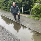 Daniel Gerber beside ponding which had been occurring outside his property any time it had rained...