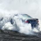 Katlyn Stoddart, of Tapanui, smokes it up in her Ford Falcon during the Lawrence Burnouts at the...