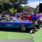 Ambulance staff tend to an injured person after a BurgerFuel car swerved into a crowd at the...