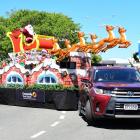 Santa Claus sits atop his sleigh with reindeer leading the way in Dee St, during the Invercargill...