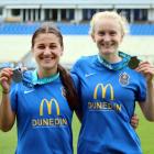 Rose Morton (left) and Hannah Mackay-Wright celebrate with their silver medals after the National...