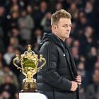 A dejected Sam Cane walks past the Webb Ellis Cup. He was the first player to be sent off in a...