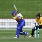 Otago Sparks batter Felicity Robertson drives at Wellington Blaze wicketkeeper Jess McFadyen...