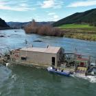 A dredge owned by Cold Gold Clutha Ltd works the Clutha River about 5km south of Beaumont. PHOTO:...