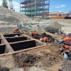 Archaeologists excavate the remains of 12 brick tanning pits at the new Dunedin hospital site...