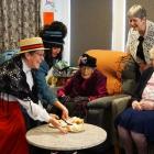Handing out treats to Iona Home &amp; Hospital residents Daphne Fielding and Maisie Glenn (both...