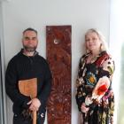 Te Pakihi o Maru school principal Stacey Honeywell and taonga carver Jackson Grey with one of two...