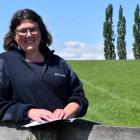 Otago South River Care project co-ordinator Rebecca Begg reads the booklet Start Your Own Farm...