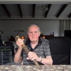 Retired freezing worker Bert Meikle holds a cattle pithing spear he used in the Mataura meatworks...