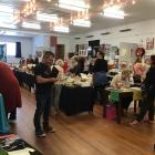 Visitors browse the artworks at a previous OpenArts Annual Art Fair. Photo: supplied