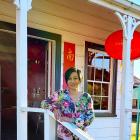 Lawrence Chinese Camp Charitable Trust chairwoman Denise Ng stands outside the camp’s Joss House...