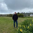 Otago Peninsula Community Board chairman Paul Pope is flanked by the Grants Braes Football Club...