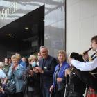 H&amp;J chief executive John Green claps as the bagpipes play for the final closure of the...