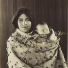 A wahine Māori holds a child, in about 1903, in this image from Te Rūnanga o Moeraki album. Photo...