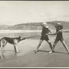 Children and a dog play tug of war at Warrington Beach, about 1930. Photo: George Chance, Hocken...