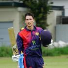 South-African born Bevon-John Jacobs celebrates a century for Sydenham against East Shirley....