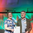 Olivia Weatherburn receives the Amabel Fulton APEN Award from Jeff Coutts during a conference in...