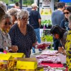 Customers at the Oamaru Christmas Eve market swarm the berry stalls to get their dessert...