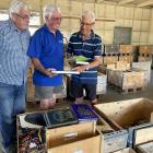 Sorting books for the annual Alexandra Rotary book sale are, from left, Rotary members Denis...