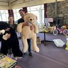 Tamah Alley and Jayden Cromb hug-test some of the toys donated for the toy swap free-for-all...