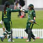 Bismah Maroof (right) and Aliya Riaz of Pakistan celebrate after winning the first match of the...