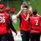 Will O’Rourke (second right) celebrates with his Canterbury team-mates after taking a wicket in...