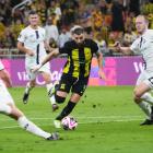 Karim Benzema of Al Ittihad is challenged by Auckland City players during their match in Jeddah....