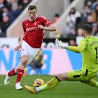 Chris Wood goes past Newcastle goalkeeper Martin Dubravka to score one of his three goals. Photo:...