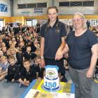 Kaiapoi Borough School pupil Makayla Krahagen, 13, cuts the 150th celebration cake with Board of...