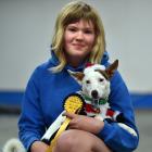 Libby Mooyman, 13, holds Jack Russell terrier Dexter after his tricks won top prize.