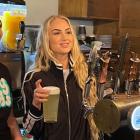 Swiss football star Alisha Lehmann pours a pint at The Brew Bar, in the Octagon, in July. PHOTO:...