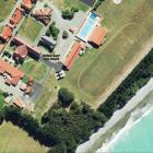 An aerial view from this year shows coastal erosion encroaching towards Waitaki Boys’ High School...