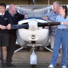 Sharing a laugh at Dunedin International Airport on Monday are (from left) Mainland Air chief...