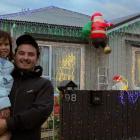 Conrad Thomas, with the help of his niece Heidi Orr, 4, has transformed his South Dunedin home...