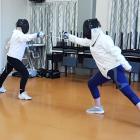 Waimate Whitehorse Lions members demonstrate the sport of fencing at the club’s meeting. PHOTO:...