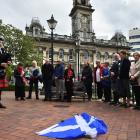 City of Dunedin Pipe Band piper Oe Hayward plays during the unveiling ceremony for Angus...