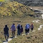 Walkers explore the Bannockburn Sluicings on a summer’s day. PHOTO: JENNY CHRISTENSEN