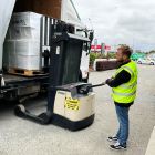 Satisfy Food Rescue operations co-ordinator Cameron Crawley uses the walkie stacker forklift to...