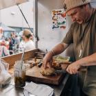 Chef Ben Davies at work in his new ‘All Good Bagels’ food truck. PHOTO: SUPPLIED